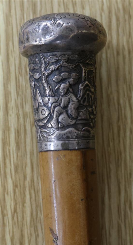 A malacca cane with Chinese silver ferule
